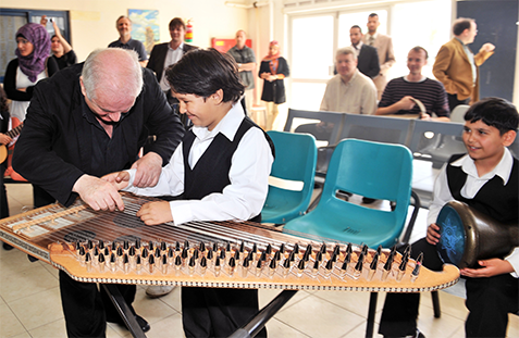 Maestro Barenboim with one of the young musicians of the Al-Qattan foundation who performed for him in honour of Mr. Barenboims first-ever visit to the Gaza Strip in May 2011, to perform a peace concert for the people of Gaza. UN Photo/Shareef Sarhan 