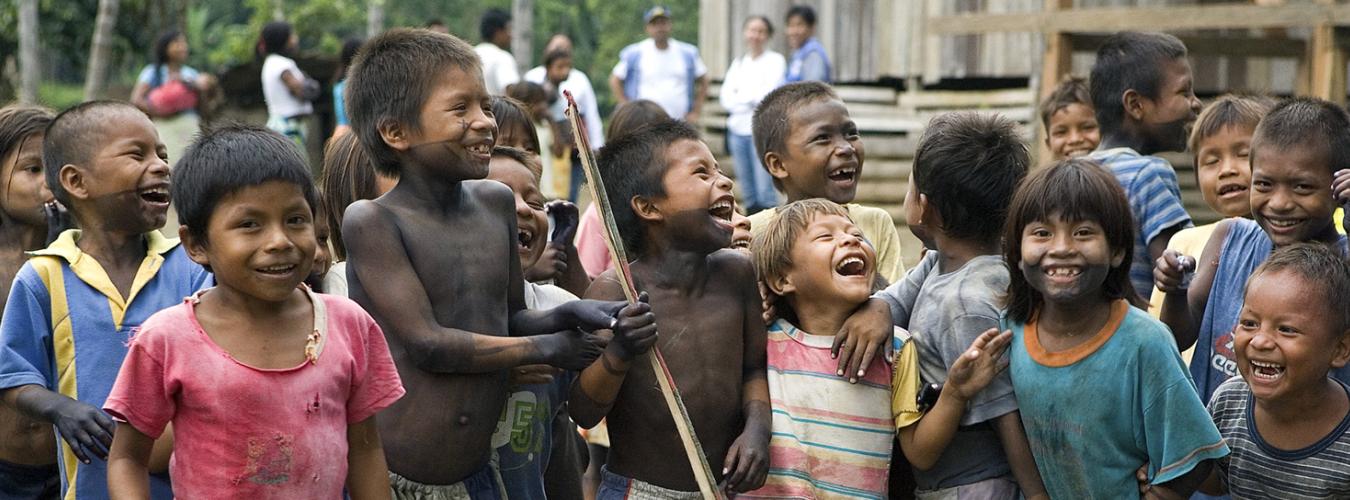 A group of children from the indigenous Ember people smiling.